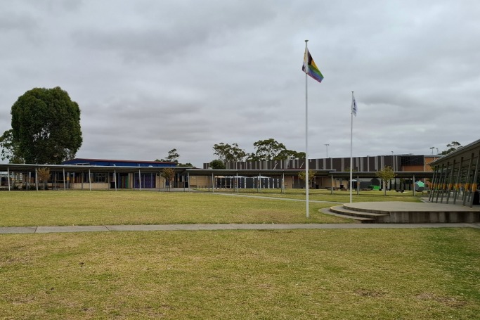 School oval with building and flag post